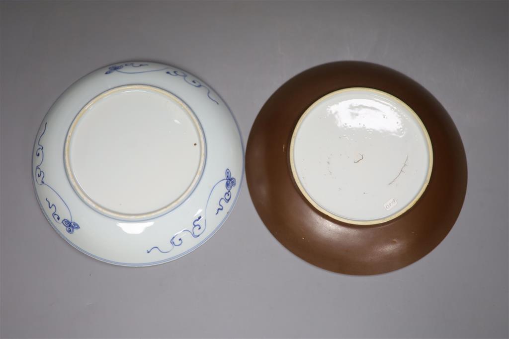 Two Chinese Kangxi blue and white dishes, one with Batavia cafe-au-lait glaze to the underside, diameter 22cm